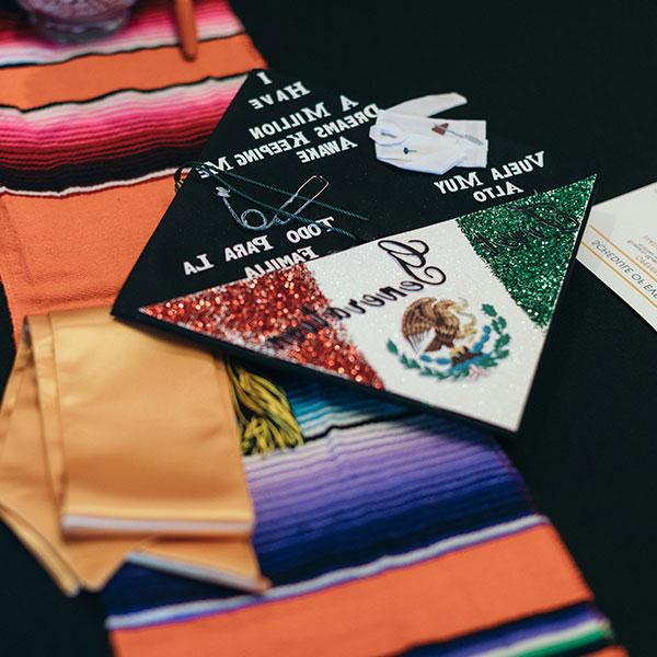 Spanish decorated graduation cap and gown